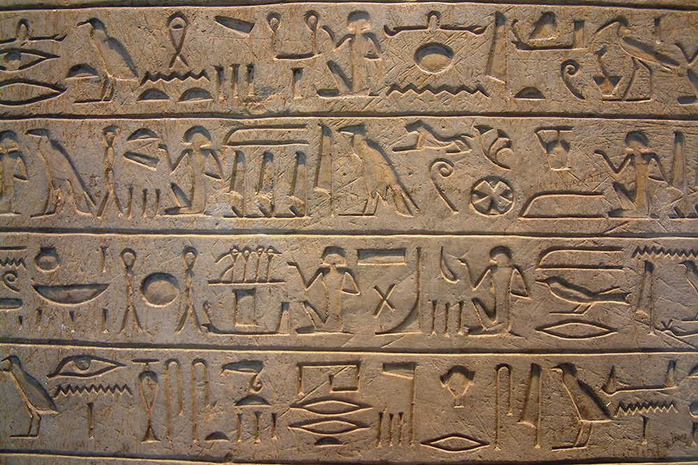 Linguistic Anthropology: Egyptian Hieroglyphics on stone found in ancient temple, close up of ancient script