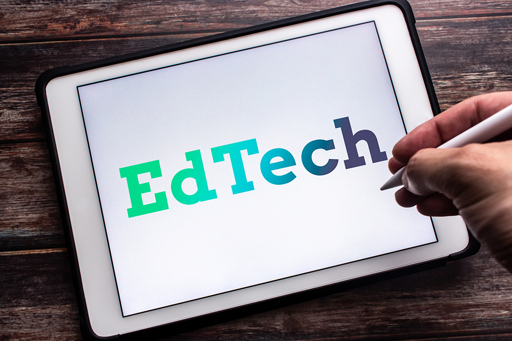 Educational Technology: Closeup keyword EdTech (EduTech, Educational technology) on tablet.