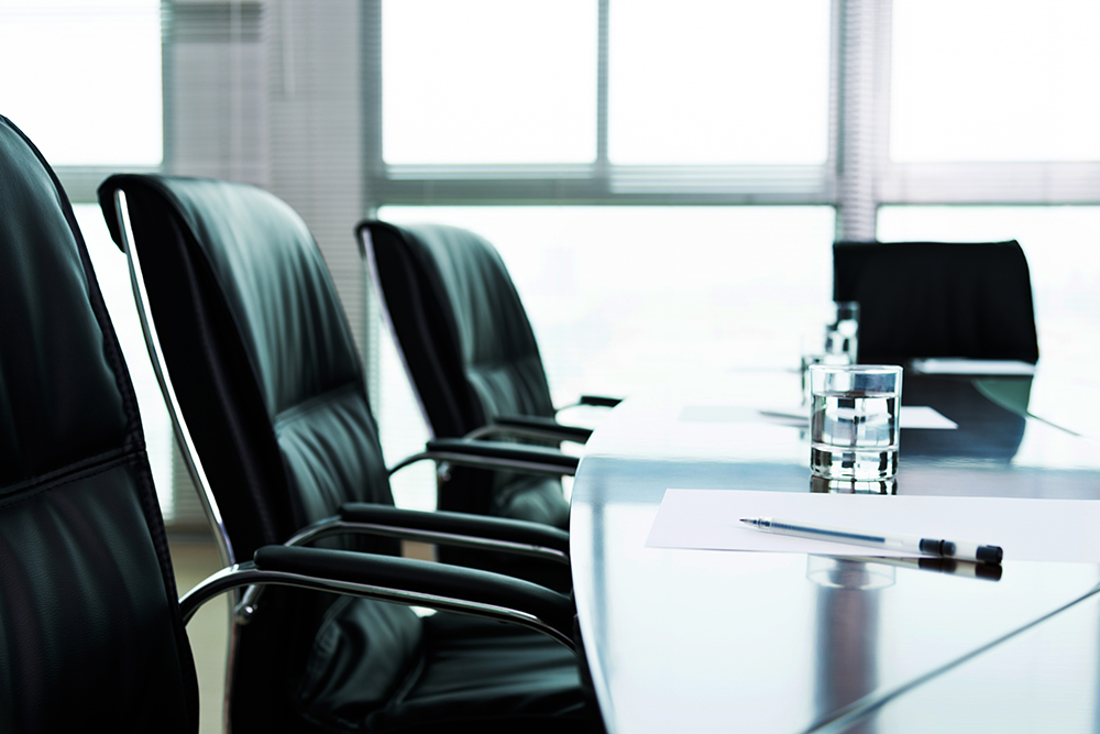 Organization Communication: Bright light shining in conference room.