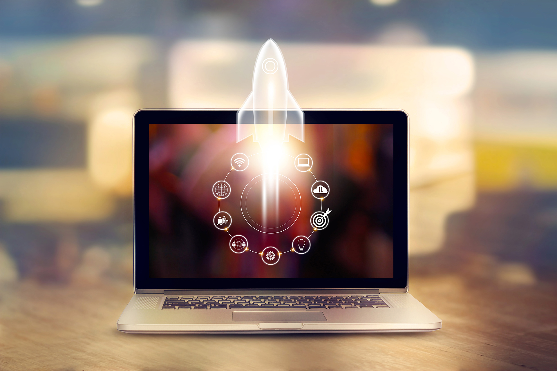 Getting Started-Startup concept. laptop on wooden table and and icon network connection with rocket icon flying out of screen